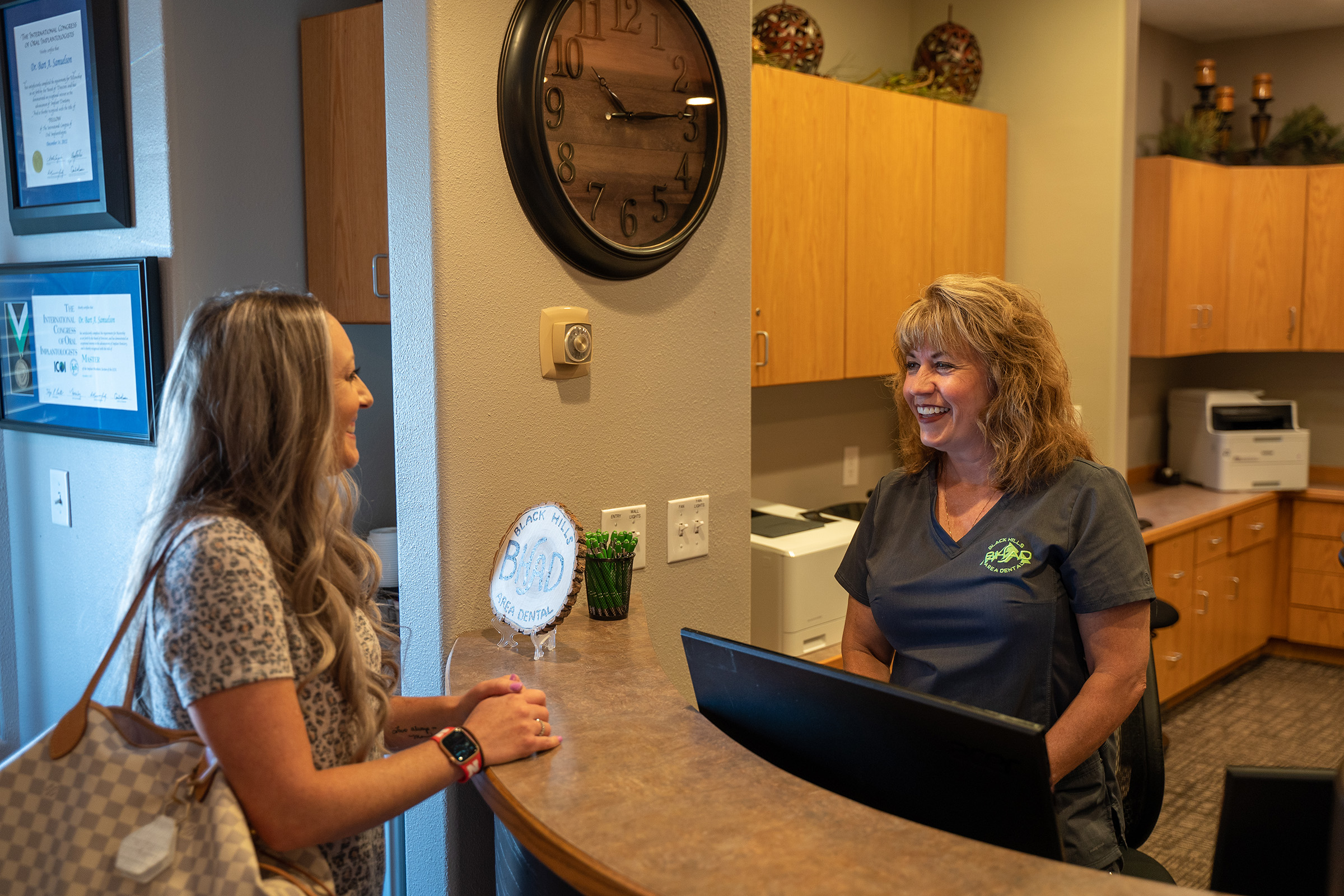 Dentist examining a patient's mouth during an oral cancer screening in Rapid City, SD