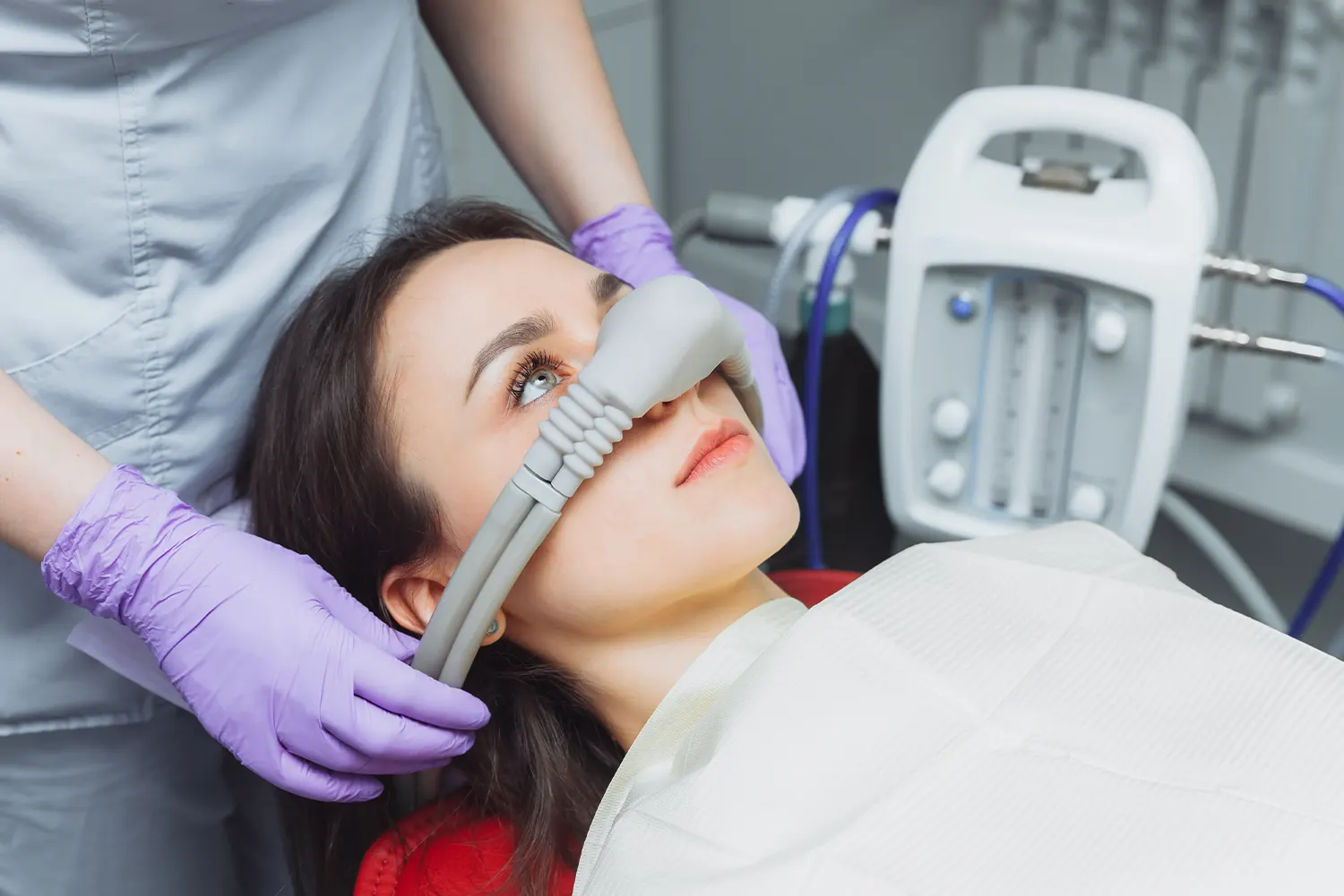 Dentist examining a patient's mouth during an oral cancer screening in Rapid City, SD